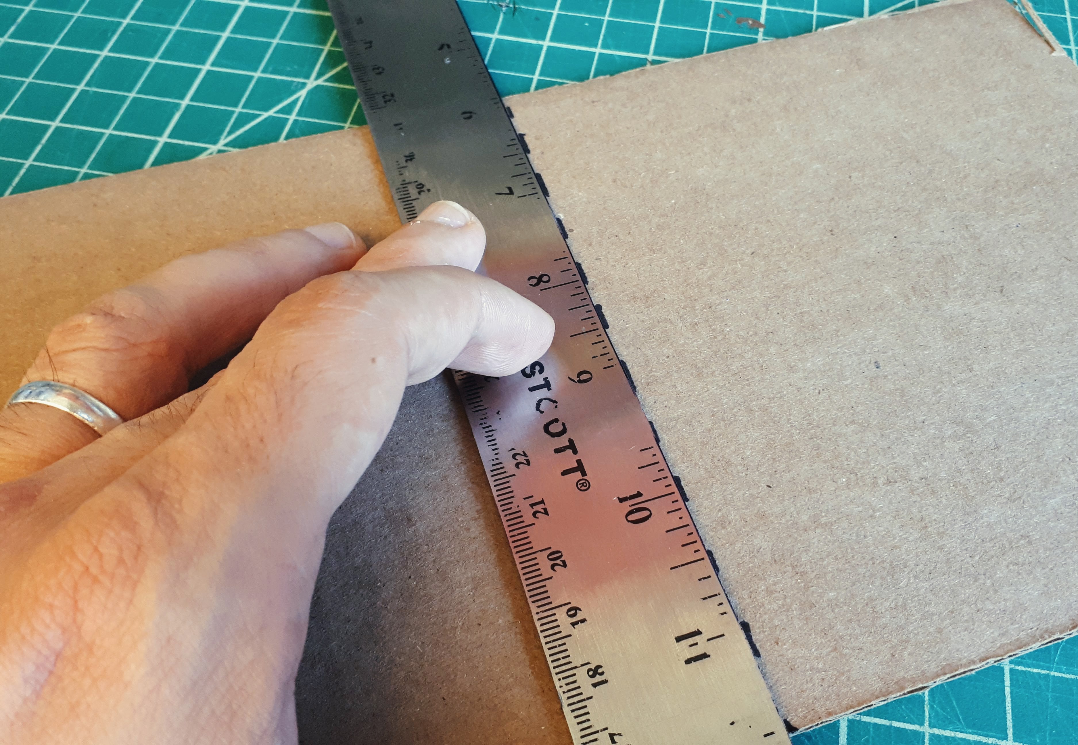 Example of folding a scored line.